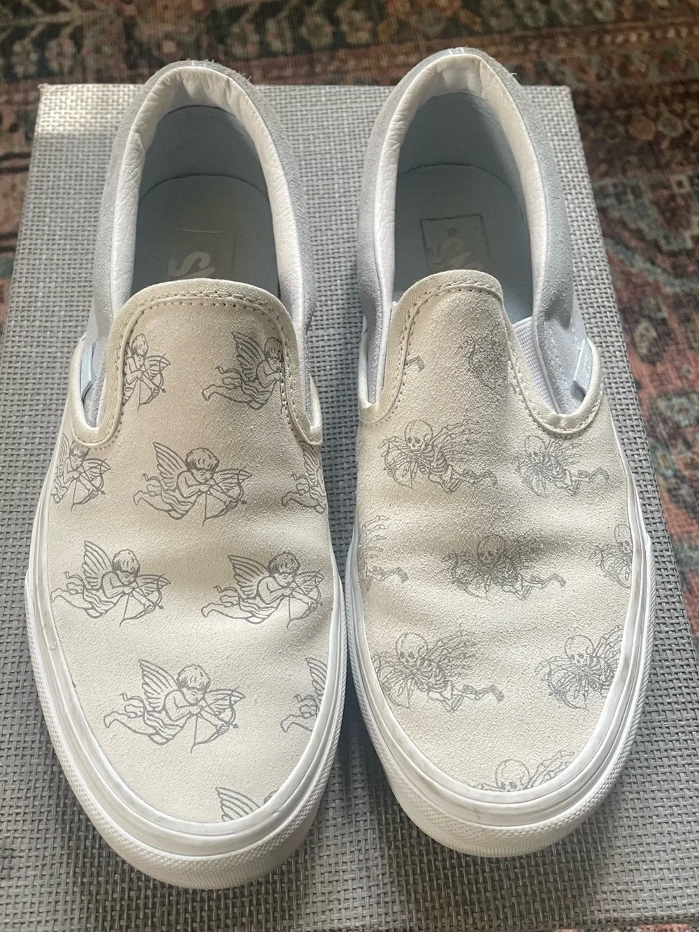 Vans “I Love You to Death” White Slip-On Sneakers with Cherub & Skeleton Print